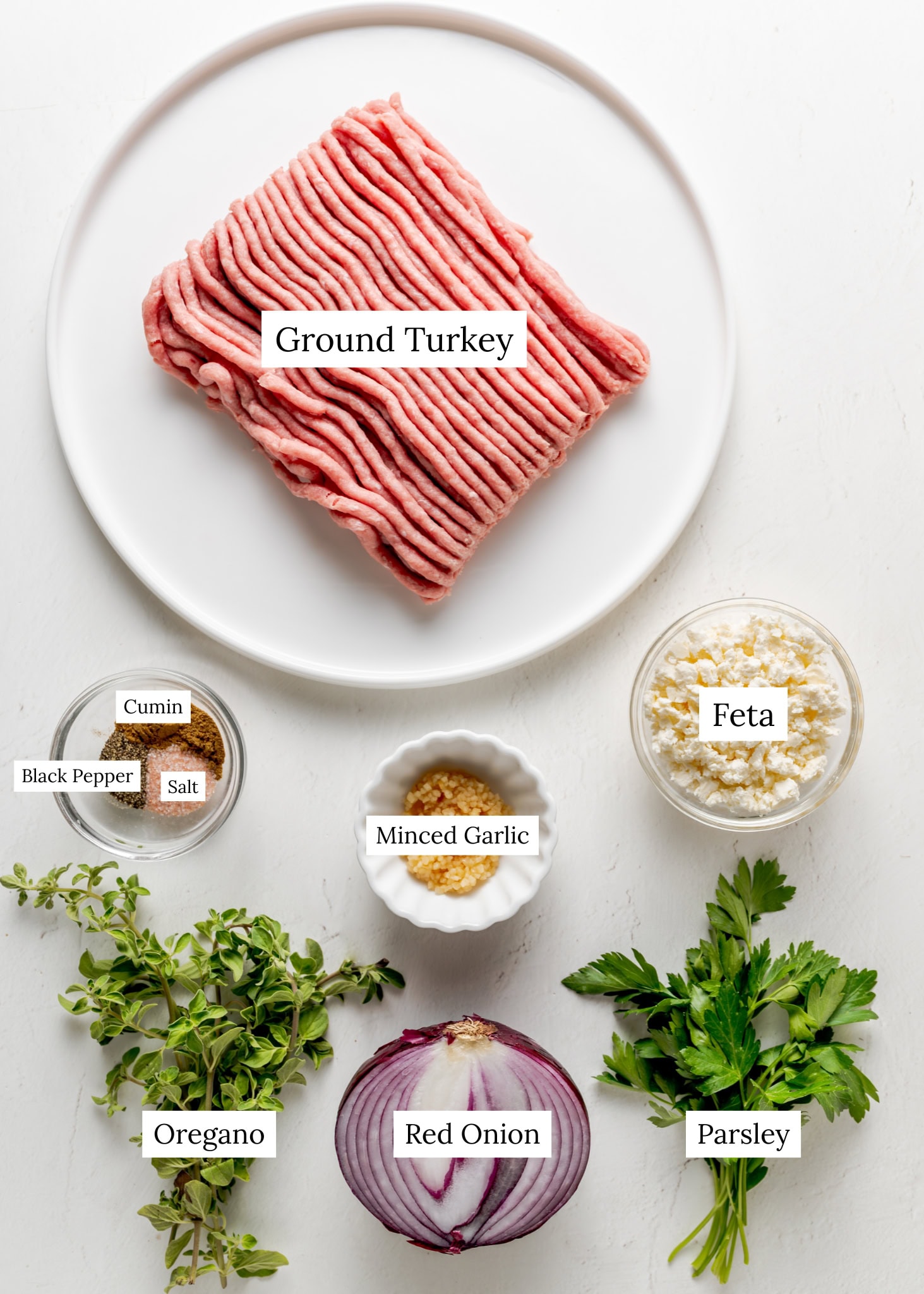 Mediterranean turkey burger ingredients.
Ground turkey, red onion, feta, minced garlic, fresh oregano, fresh parsley, cumin, salt, black pepper.