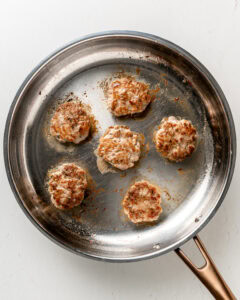 Fried turkey patties fully cooked.