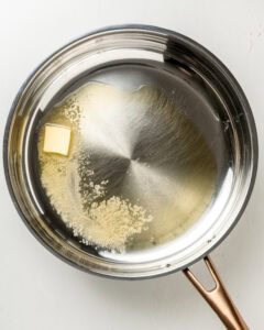 Melt the butter and olive oil in a large skillet.