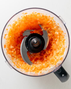 Mincing vegetables in a food processor.
