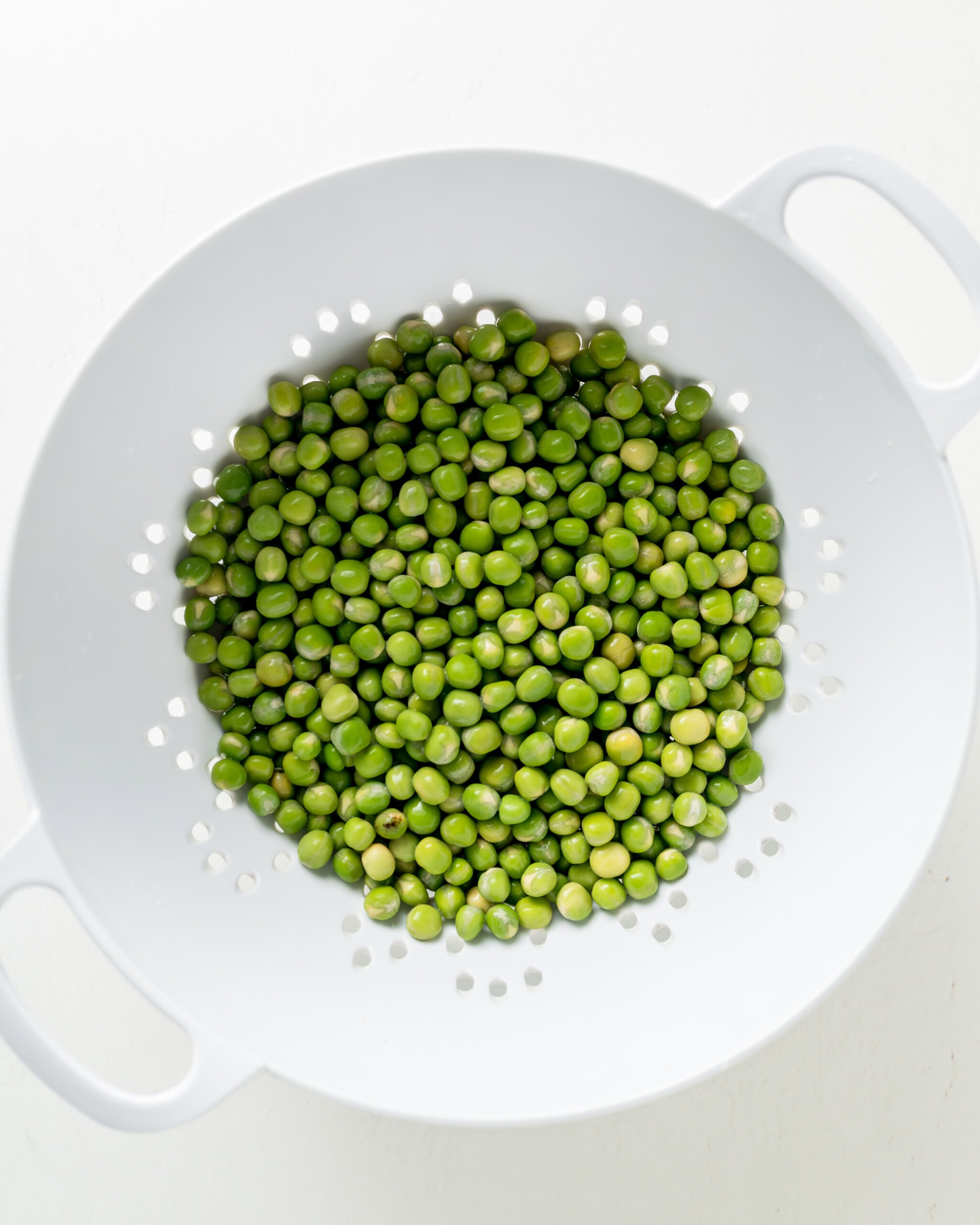 Wash the marrowfat peas to remove the baking soda after the overnight soak.