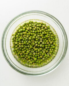 Soak the marrowfat peas in a large clear bowl with boiling water and baking soda.