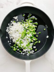 Sauteed onion and green pepper in a large skillet.